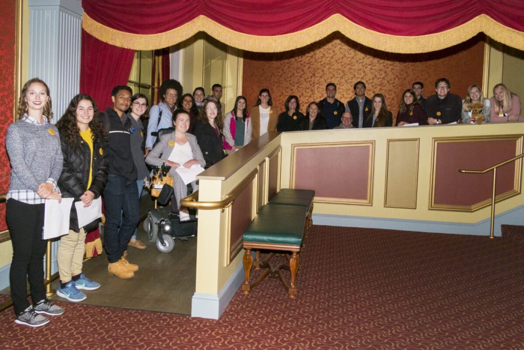 Photo of a group of students posing on a ramp at the Missouri Theatre.