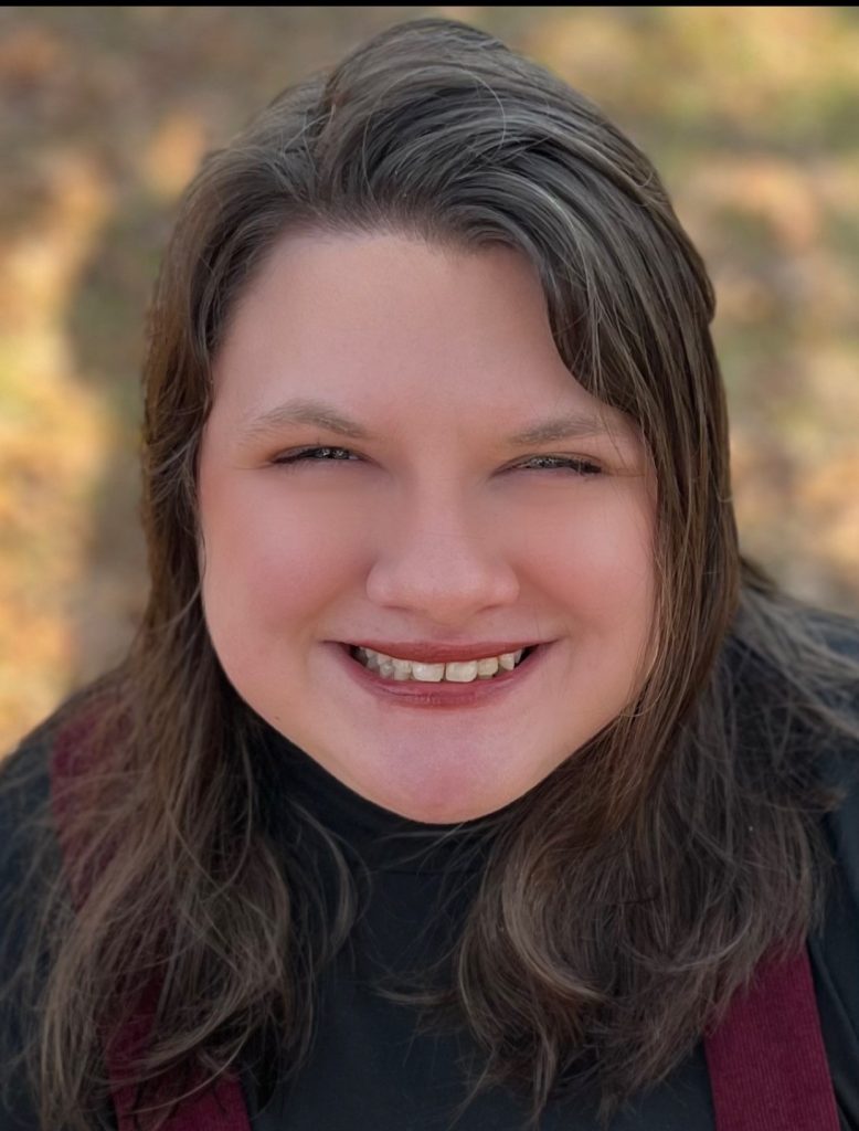 Kara Fortson, a smiling white woman with long dark hair.